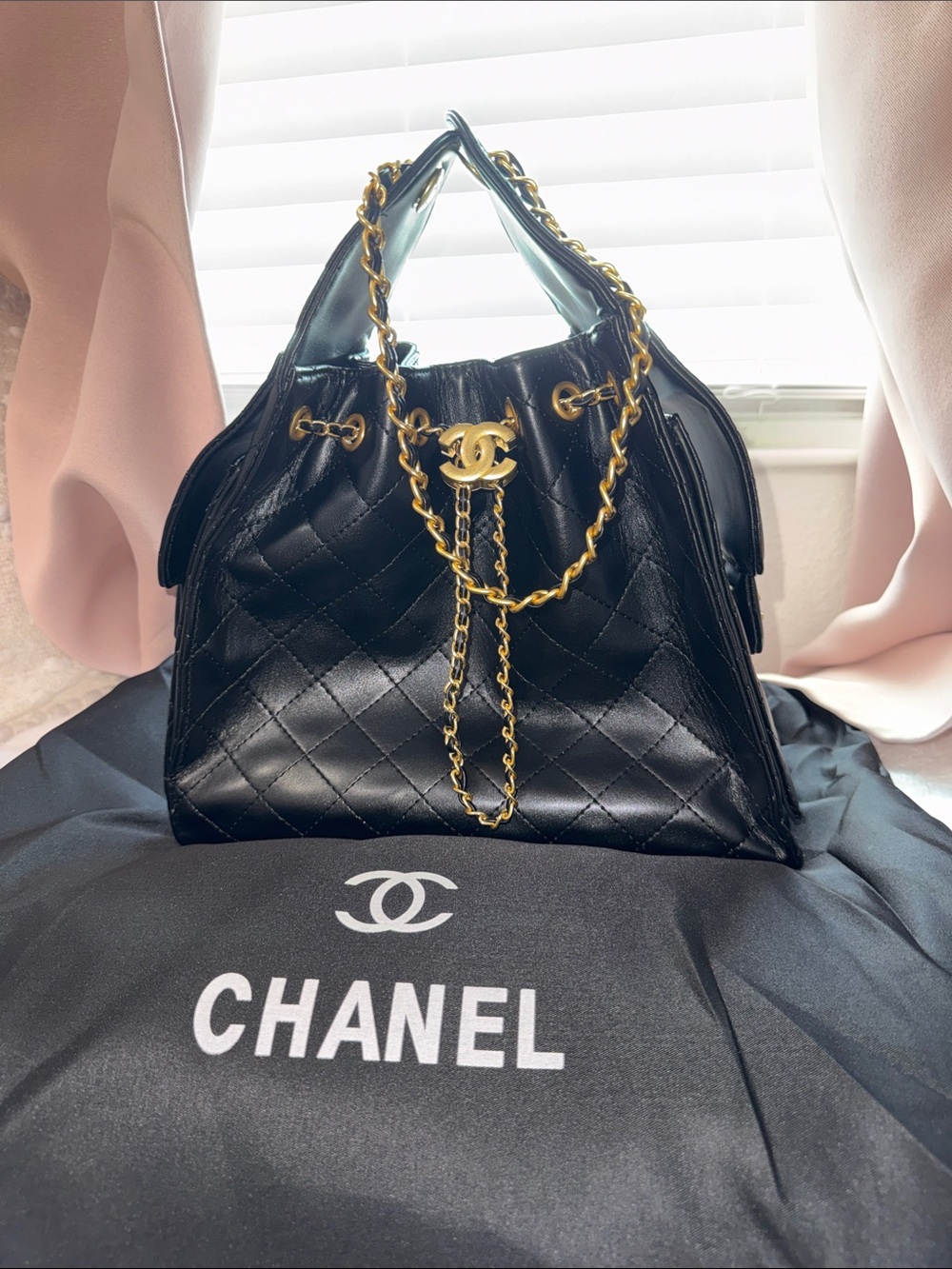CHANEL Black Quilted 
 Shoulder Drawstring Bag with Gold Chain